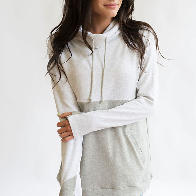 White and grey pull over sweatshirt.
