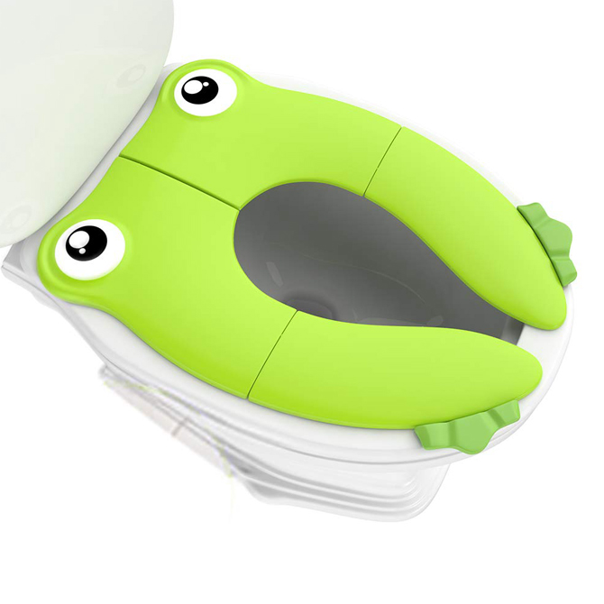 A bright green toilet seat cover has eyes and frog-like feet sits on a toilet.