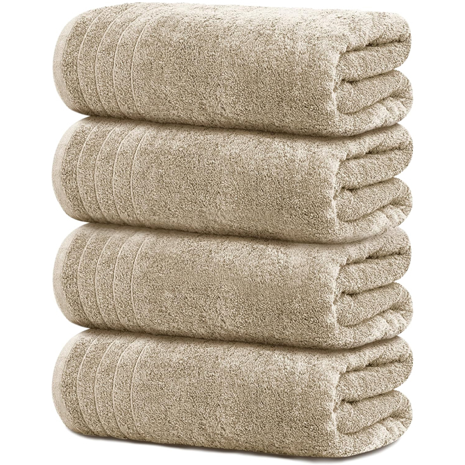 Stack of four tan towels.